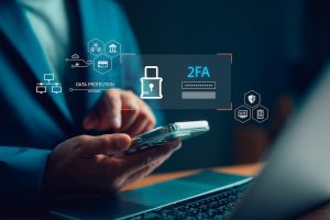 Businessman using smartphone for two-factor authentication (2FA) with data protection icons. Concept of secure login, cybersecurity, password security, identity verification, and online privacy