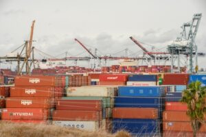 Containers wait to be transported during supply chain disruption.