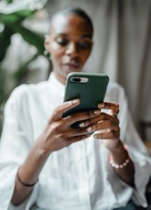 Woman conducting business with a cellphone. Digital transformation concept.