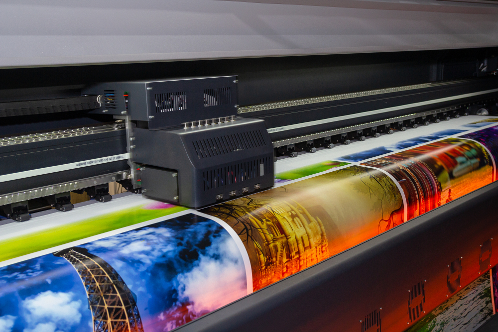 Large format digital printing press in operation. 