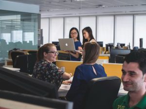 image of employees in an office. concept of secure printer environment.