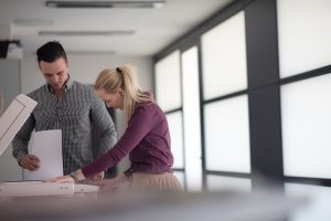 happy business people group at modern office copy documents on machine